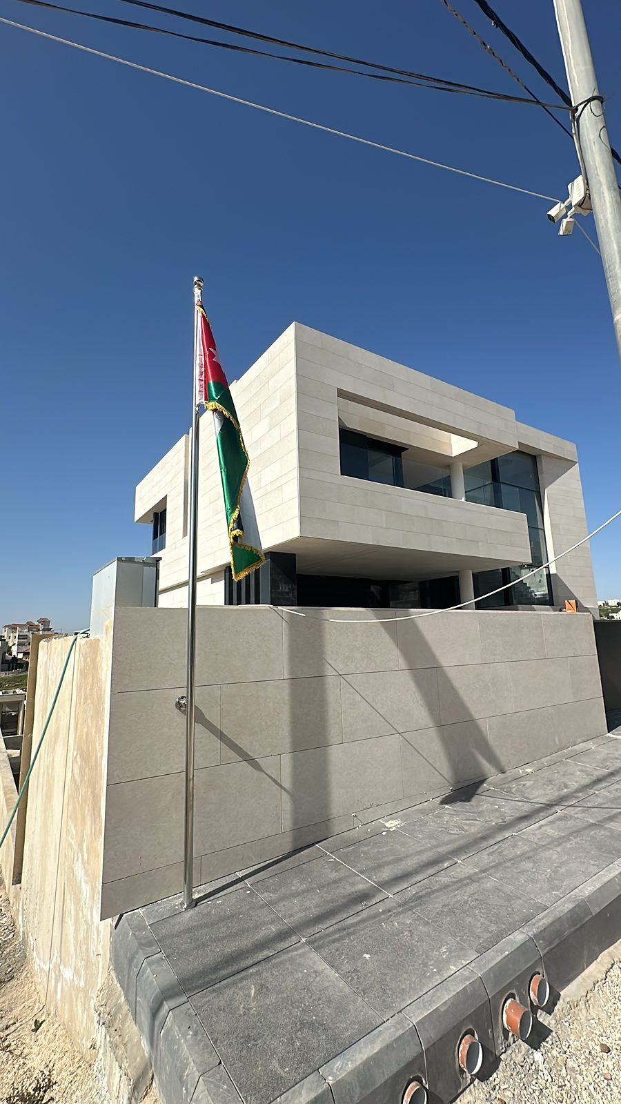 Stone-clad villa and boundary wall
