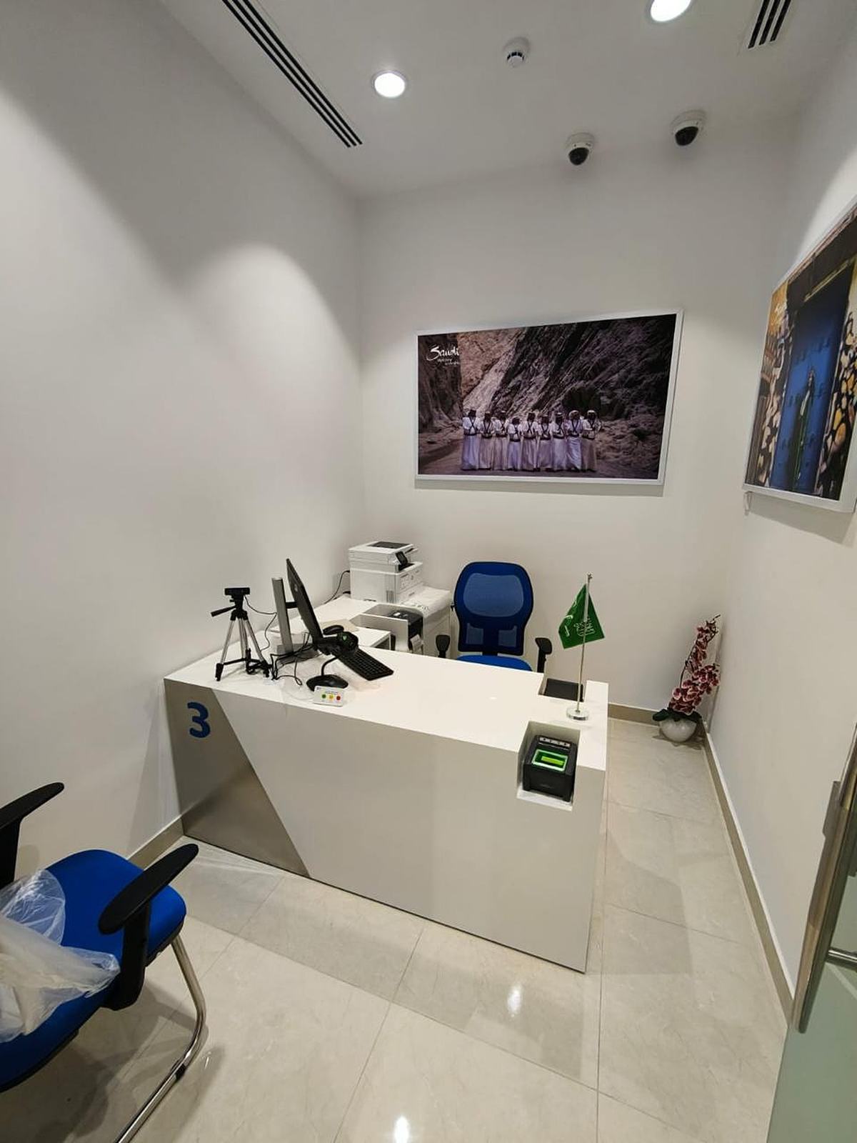 Service booth with desk and framed photography