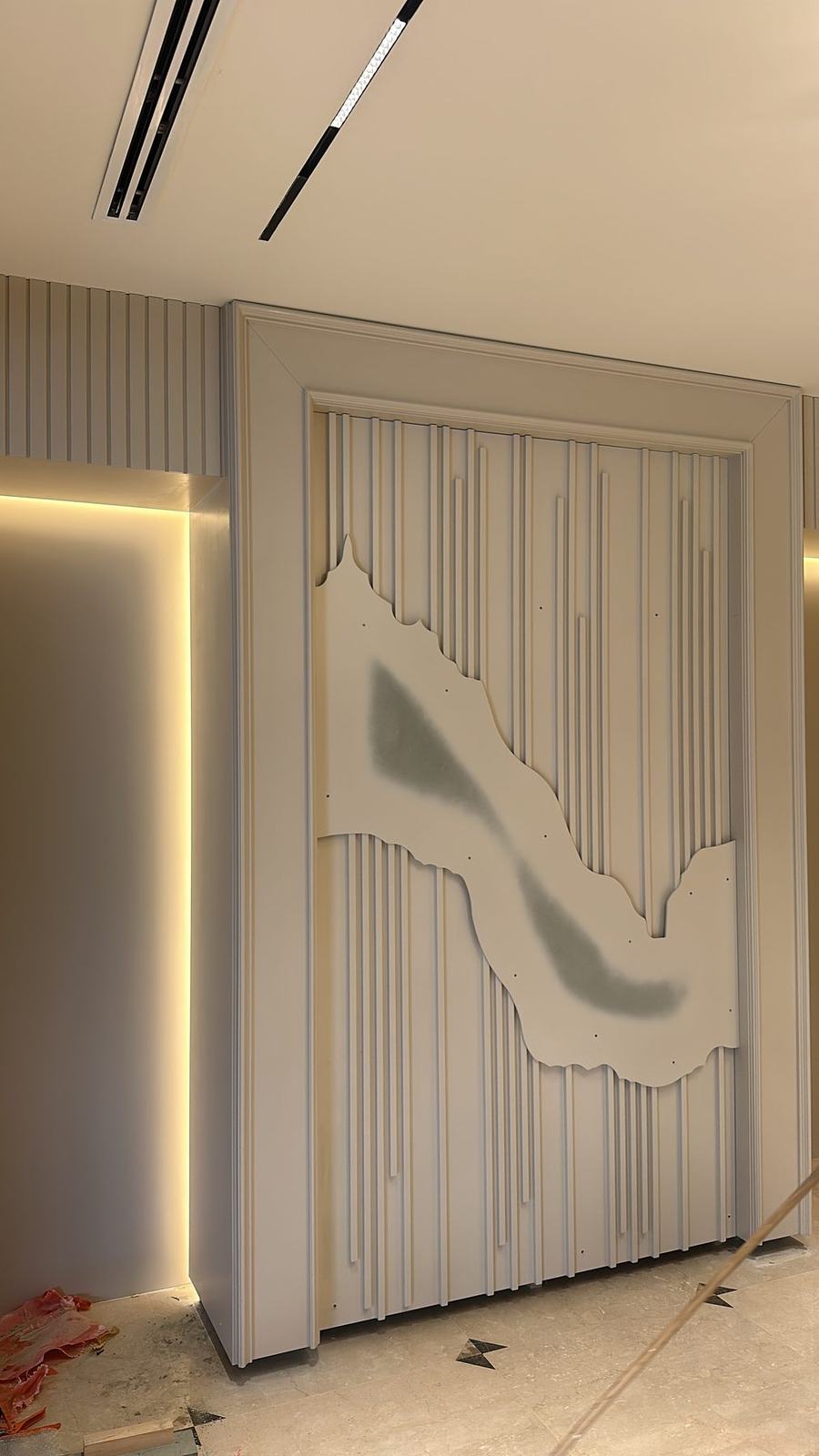 Carved wall panel with hidden lighting